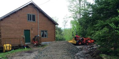 1 1/2" crushed gravel base layer getting ready to be spread out on this top tier of Gravel driveway.