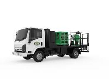 White utility truck with a green compressor on a large truck bed