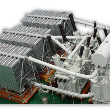 High-voltage electrical transformer with cooling fins and bushings.