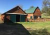 Two barns in the valley that have 13 stalls
