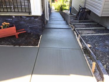 Concrete sidewalk and steps in broom finish