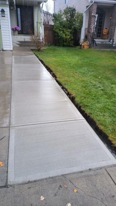 Concrete driveway extension in broom finish