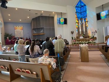 People sitting and praying inside the church