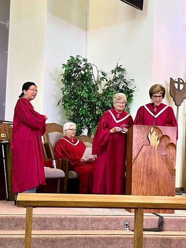 Four women going on the stage in the event.