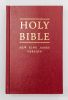 A red Holy Bible with gold lettering on the cover.