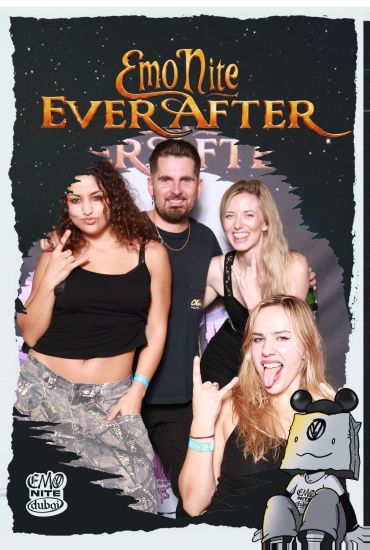 Four friends posing and having fun at Emo Nite Ever After event.