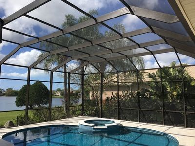 Process of painting a pool cage from white to bronze.