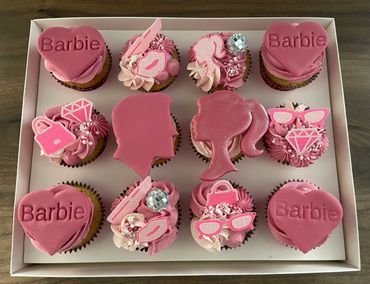 12 pink barbie themed cupcakes
