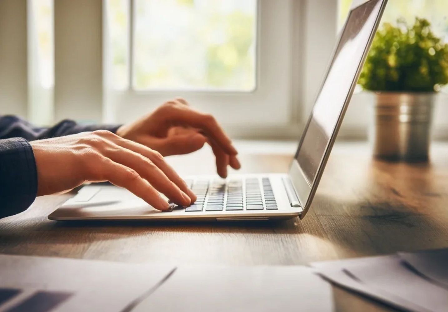 Person typing on a laptop