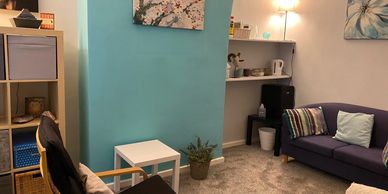 Counselling room with sofa and armchair
