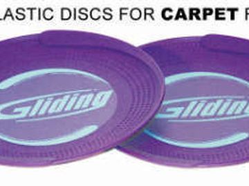 Purple plastic sliding discs for carpet floors.