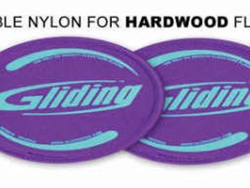 Purple Gliding discs for hardwood floors to aid smooth movement.