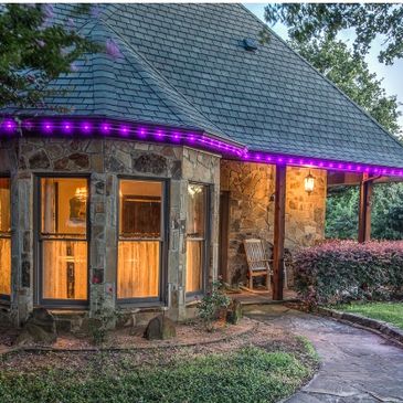 Permanent Roofline Lighting purple LED lights on a residential house, color changing lights.