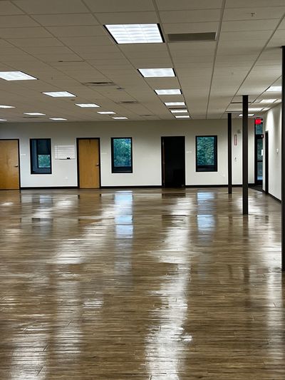 Office floor scrubbed and clean before set up for employees