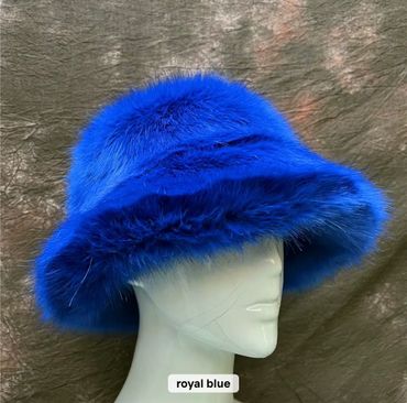 Luxurious royal blue fur hat displayed on a mannequin head.