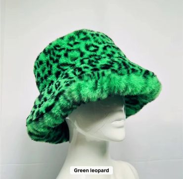 Green leopard print furry bucket hat on a white mannequin.