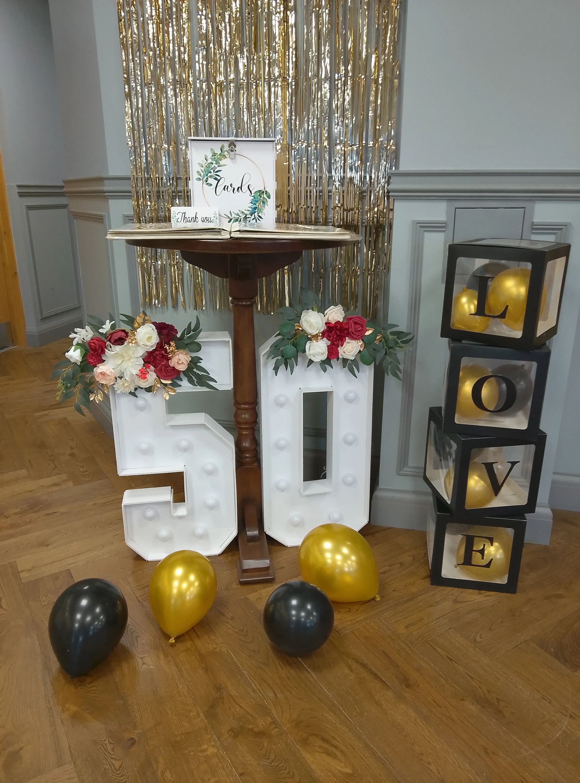 Elegant wedding decor with floral and gold accents.