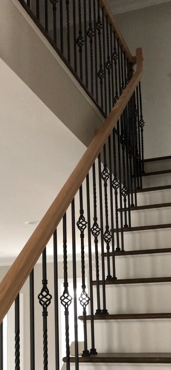 Over the post railing system with metal balusters.