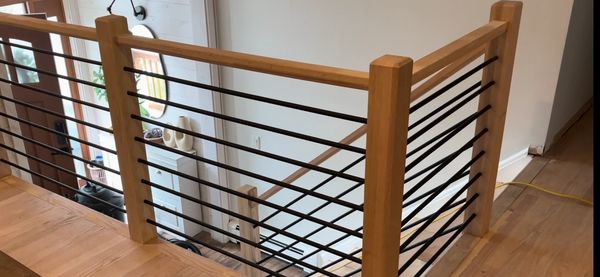 Modern railings made with square red oak posts and handrail.  