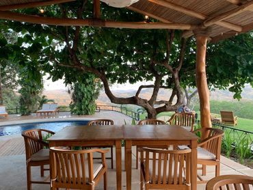 Dining area beside swimming pool