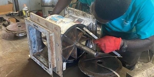 A person working on a motor.