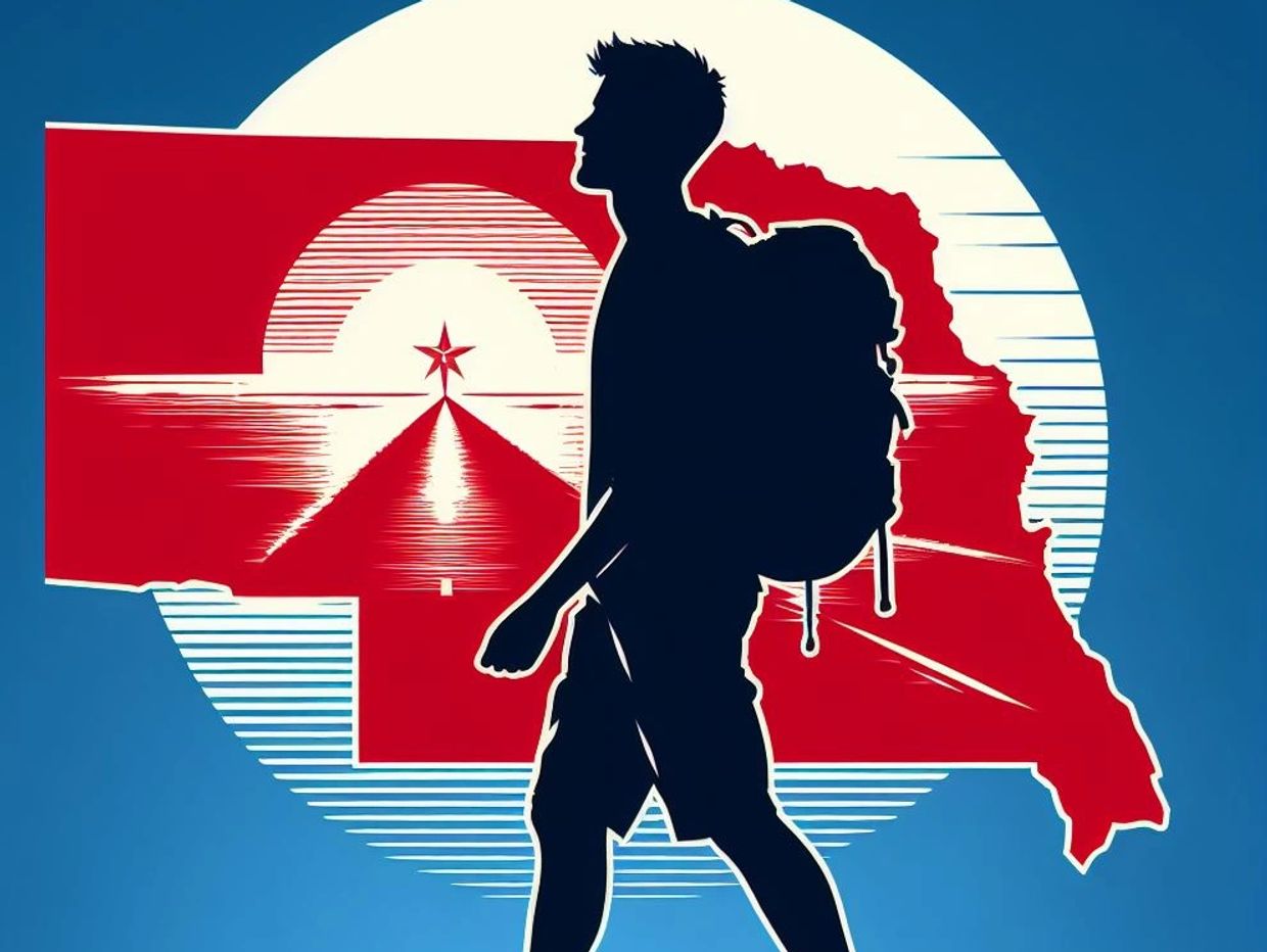 Silhouette of a hiker with a backpack in front of a red and blue scenic backdrop.