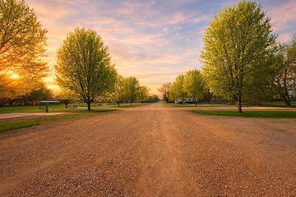 IMAGE OF CAMPGROUND GRAVEL ROAH WITH SUBTLE SUNSET GLOW
