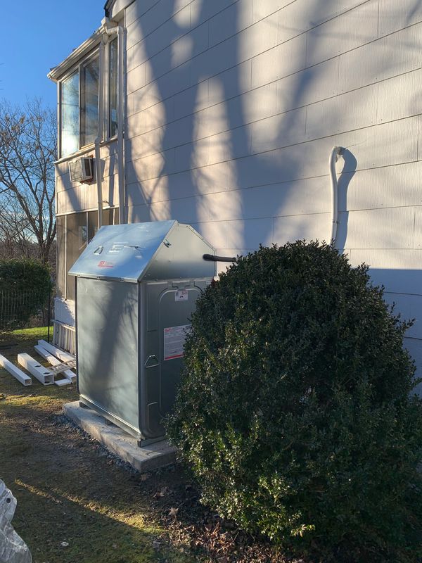 New Roth 1000L (275 gallon tank) on a cement pad with outdoor cover.