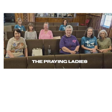 A group of women seated in a church, captioned 'The Praying Ladies.'