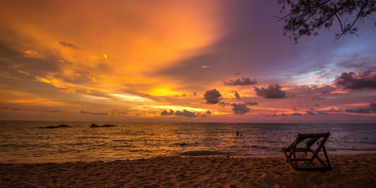 Beach Chairs on beach during sunset