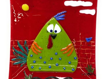 A green funky chicken named Gertie on a red background.