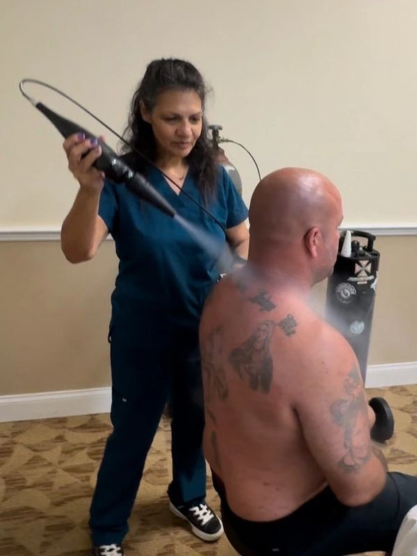 Dr. Jett Kerns peformiing Cryotherapy on IBJJF Word Champion Anthony Falatico