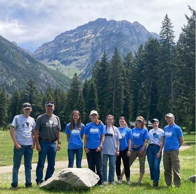 Luccock Park 2022 staff poses for a photo in front of Black Mountain.