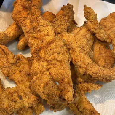 A plate of perfectly fried golden brown speckled trout.