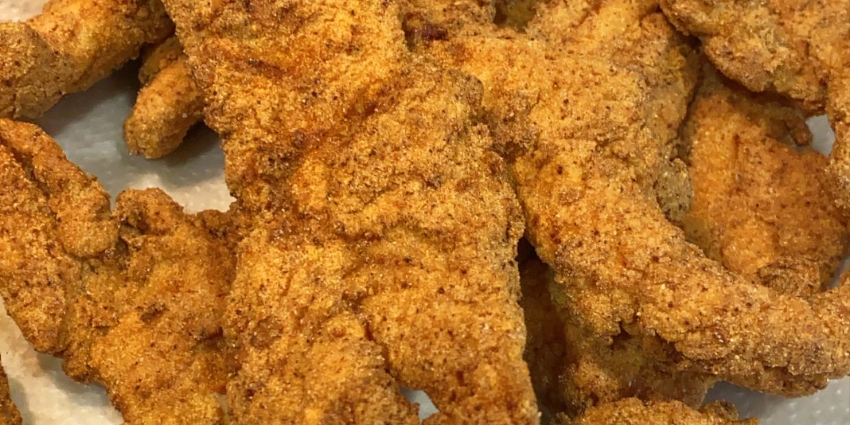 A plate of perfectly fried golden brown speckled trout.