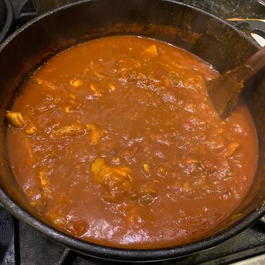 Redfish Couvillion (Courtbouillon) in a black cast iron pot.