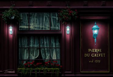 Dimly lit vintage storefront with flowers and ornate lanterns at night.