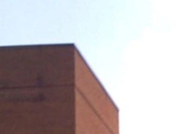 Parked Cars in Front of Brown Buildings | Montgomery Mental Health Center