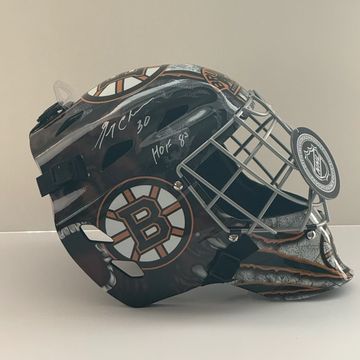 Boston Bruins goalie mask with signatures.