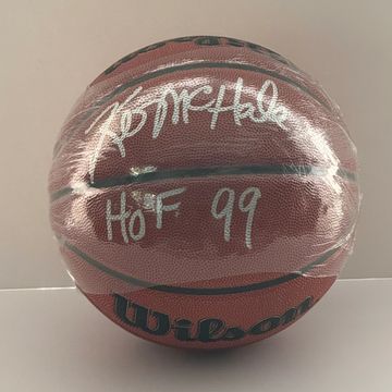 Autographed basketball with "HOF 99" inscription.