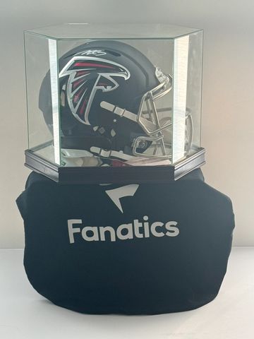 Autographed Atlanta Falcons helmet in a display case.