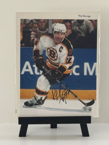 Hockey player Ray Bourque in action on ice.