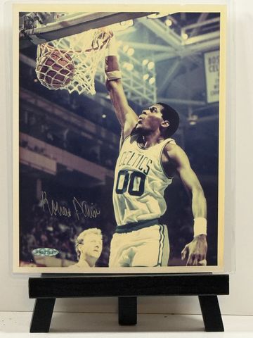Basketball player dunking for the Celtics.