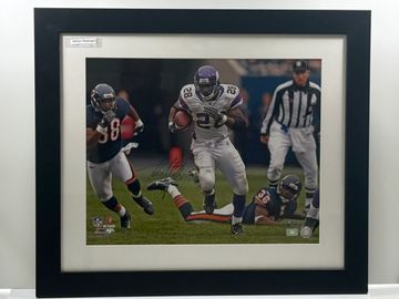 Football player running with the ball during a game.
