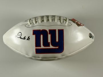 White football with New York Giants logo and autograph.