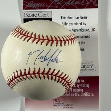 A baseball signed and authenticated with certificate.