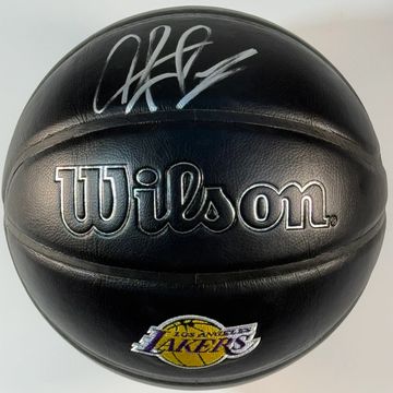 Black Wilson basketball with a Lakers logo and a signature.