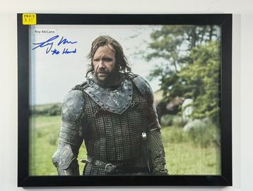 Framed photo of Roy McCann in medieval armor.