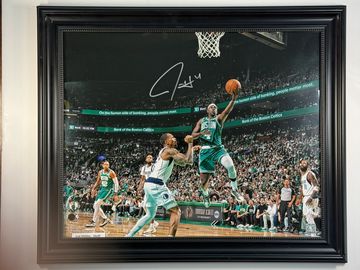 Autographed framed photo of a Boston Celtics basketball moment.