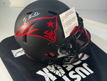 Autographed New England Patriots football helmet.